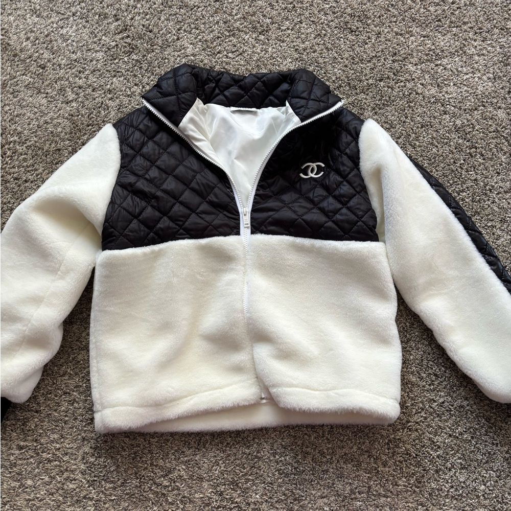 Black and White  jacket  ( not Chanel )  warm , and stylish. Size medium .